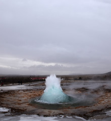 Blurred. The eruption of the Strokkur geyser in the southwestern part of Iceland in a geothermal area near the river Hvitau