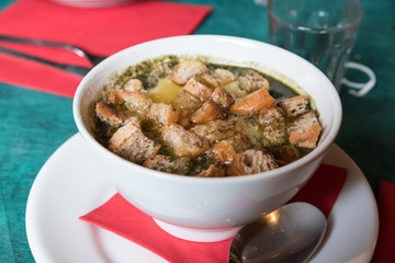 Trentino vegetable soup with melted cheese