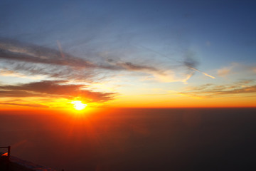 Sunrise, Bright morning sun, makes its way through the orange clouds. View, from, Mount, Athos, Greece.