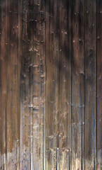 Light and shadow on vertical wooden background. With space for your text.