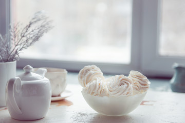 vanilla soft marshmallows and cocoa spilled on the table