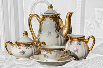 Antique porcelain tea service decorated in pure gold