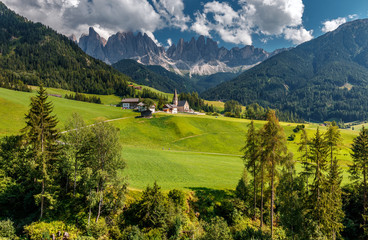 Awesome alpine Landscape in sunny day. Santa Maddalena.  Is one of the most popular photo spot of Dolomite. Famous World place. Dolomites Alps. Italy.  Amazing Natural background. Postcard