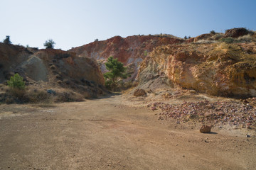 Red yellow white rocks. Hydrothermal alteration of rocks. Cyprus