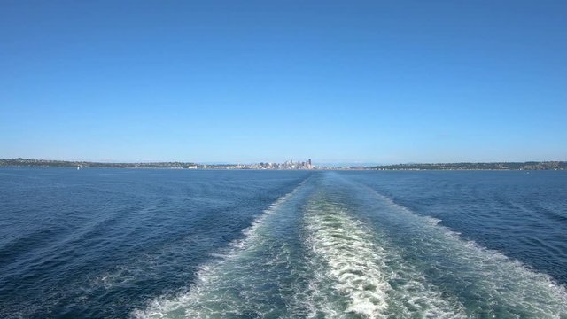 Sailing in North pacific ocean with Seattle in background, slow motion
