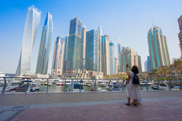 Dubai Marina city in United Arab Emirates. tourist taking photos in Marina