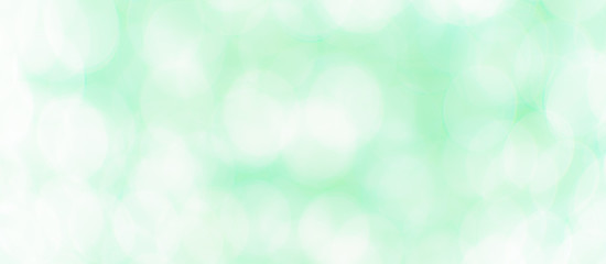 Abstract Bokeh Blue and green background of defocused glittering lights. Christmas, Party, New Year, luxurious background pattern concept. banner.