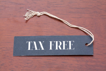 TAX FREE text on label on wood background