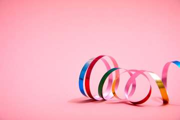 holiday colorful ribbons on the pink background