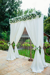 beautiful wedding arch for the ceremony of flowers.