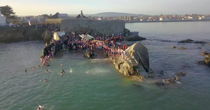 Aerial view of people swimming at Forty Foot on Christmas Day. Dublin, Ireland. December 25, 2019 