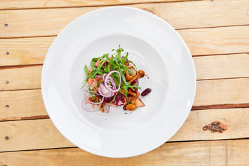 vegetarian salad with beetroot, honey agaric and red onion