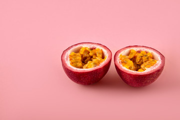 Passion fruit on a pink background, close-up, isolated, top view