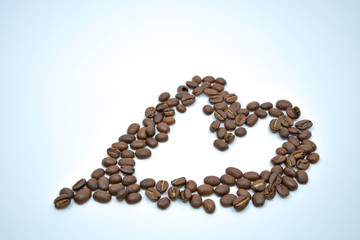 heart made of coffee beans isolated on white