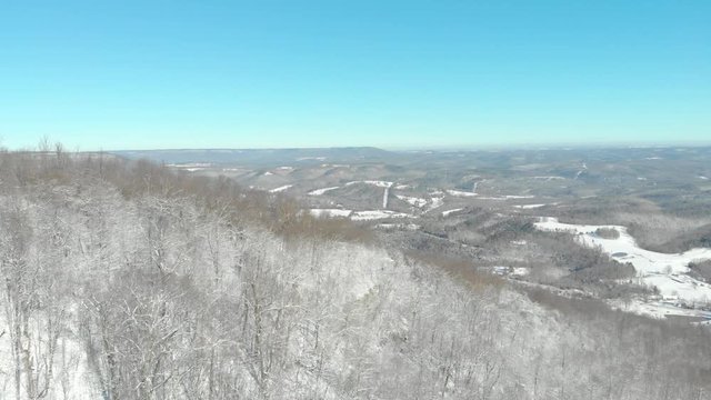 Aerial Reveal of Winter Rolling Hill Wilderness