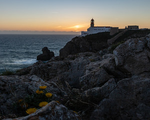 Fototapeta na wymiar lighthouse at sunset, sagres. Lighthouse of Cabo de São Vicente