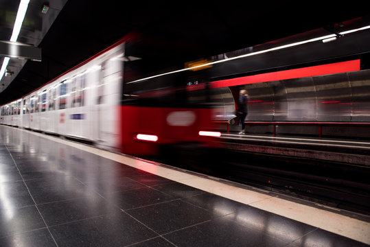 Moving subway train at metro station. Blurred metro in movement.