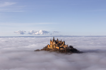 Hohenzollern castle above the clouds fog