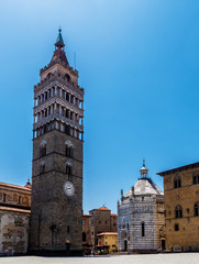 Fototapeta na wymiar Bell tower of Duomo and Battistero di San Giovanni bright sunny day in Pistoia, Tuscany Italy.