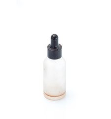 Empty transparent vape liquid bottle with residue isolated on the white background