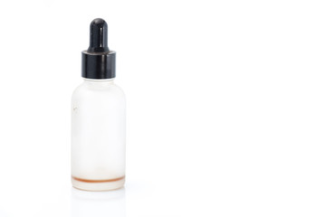 Empty transparent vape liquid bottle with residue isolated on the white background