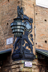Street ancient lantern in the square of Maggiore. Bologna, Italy.
