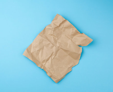 sheet of brown craft paper for packaging on a blue background