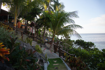 Fototapeta na wymiar Beautiful seascape with palms on tropical island 
