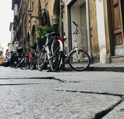 Low angle of bicycles parked on the narrow streets of Rome