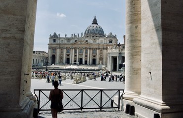 Person observing St. Peters Basilica from a distance 