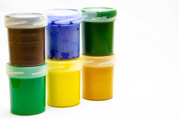 Gouache paints for drawing. Paints for painting in banks. Paints for the artist in a row, in a bunch, in macro. Art.