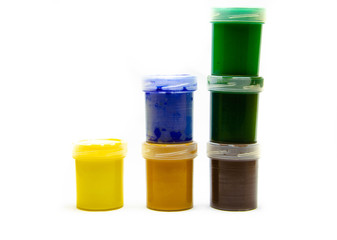 Gouache paints for drawing. Paints for painting in banks. Paints for the artist in a row, in a bunch, in macro. Art.