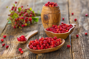 Fresh Wild strawberries on wooden background