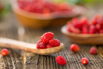 Fresh Wild strawberries on wooden background