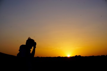 desert silhouette of a man in the sunset