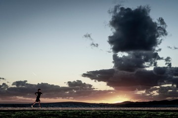 Obraz na płótnie Canvas woman walking through the field