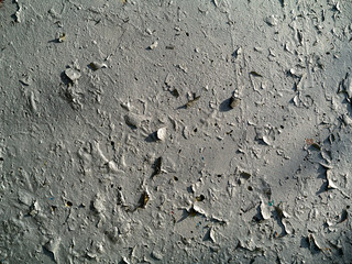 Cracked paint on a wall abstract background texture. Monochrome tone.