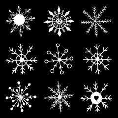 Cute hand drawn set of snowflake. Doodle vector illustration. Winter element for greeting cards, posters, stickers and seasonal design. Isolated on black background