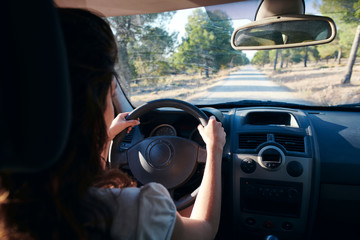  Woman driving through the mountains of Granada, Spain