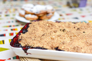 Freshly baked home made fruit crumble with ingredients fresh from the oven
