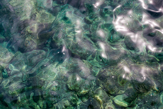 Top View Close Up Of A Sea Water Surface With Small Shiny Ripples