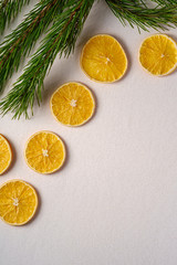 Fototapeta na wymiar Creative holiday Christmas New Year food fruit texture with dried orange with branch of fir tree macro, top view, white background copy space