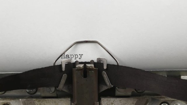 old vintage typewriter with a sheet of paper, typing the words happy 2020, holiday and christmas concept