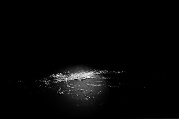 Transparent polypropylene granules plastic pellets material on black background