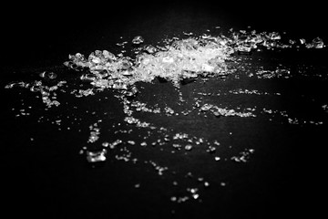 Transparent polypropylene granules plastic pellets material on black background