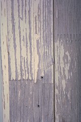 herhe is some weathered and worn down wood from the trim of a door frame on an older house