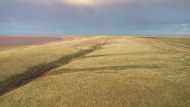 Aerial view: flight over the steppe and lake Manych Gudilo, Russia.