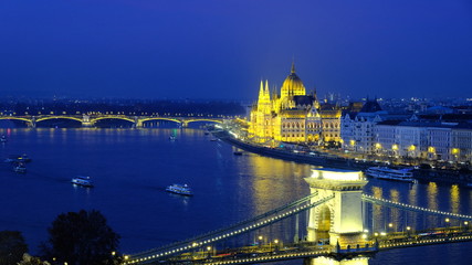 Fototapeta na wymiar Panorama of Budapest, Hungary, with illuminated Hungarian Parliament building and Chain Bridge over Danube river.