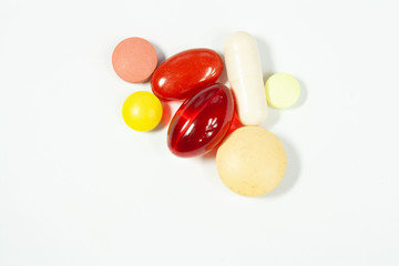 Colorful pills on a white background