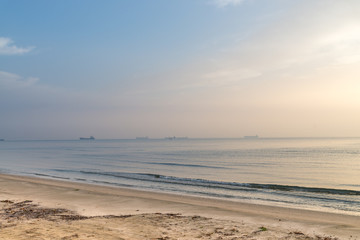 Fototapeta na wymiar Sunrise at sand beach at Mediterranean sea